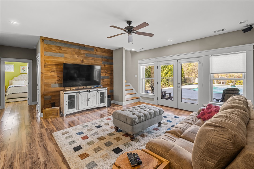 209 Crestridge Drive Seneca, SC 29672 - Photo 33 of 49 This inviting living area boasts rich wood accents and offers seamless access to the outdoors.