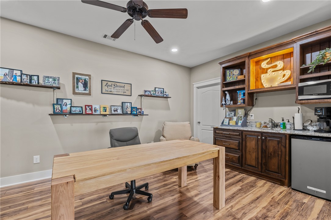 209 Crestridge Drive Seneca, SC 29672 - Photo 34 of 49 This versatile space features durable flooring and a convenient built-in wet bar for seamless entertaining.