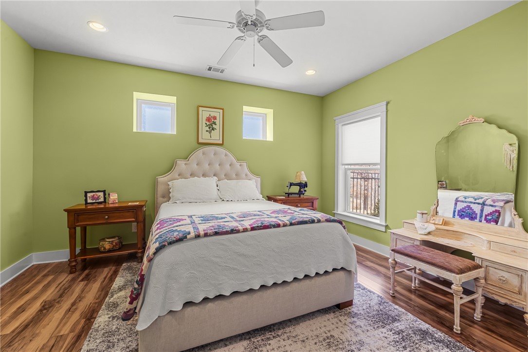 209 Crestridge Drive Seneca, SC 29672 - Photo 37 of 49 This cozy bedroom features durable hardwood flooring and a ceiling fan, creating a comfortable retreat.