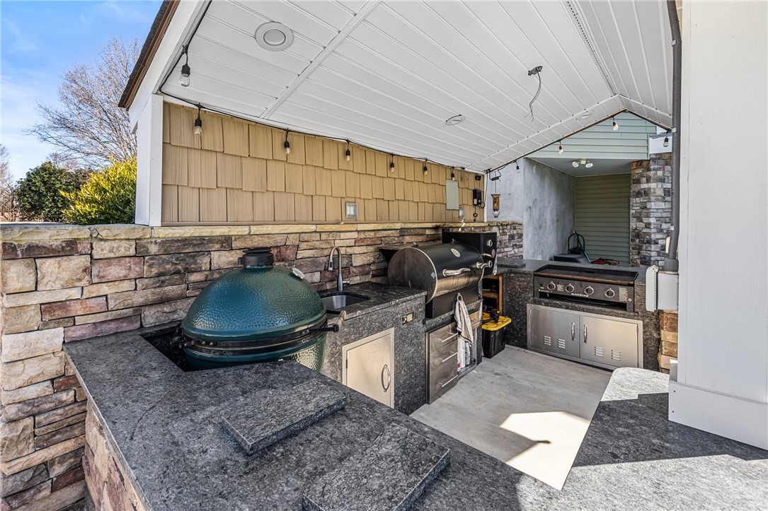 209 Crestridge Drive Seneca, SC 29672 - Photo 43 of 49 This impressive outdoor kitchen offers a premier space for culinary creations and entertaining.