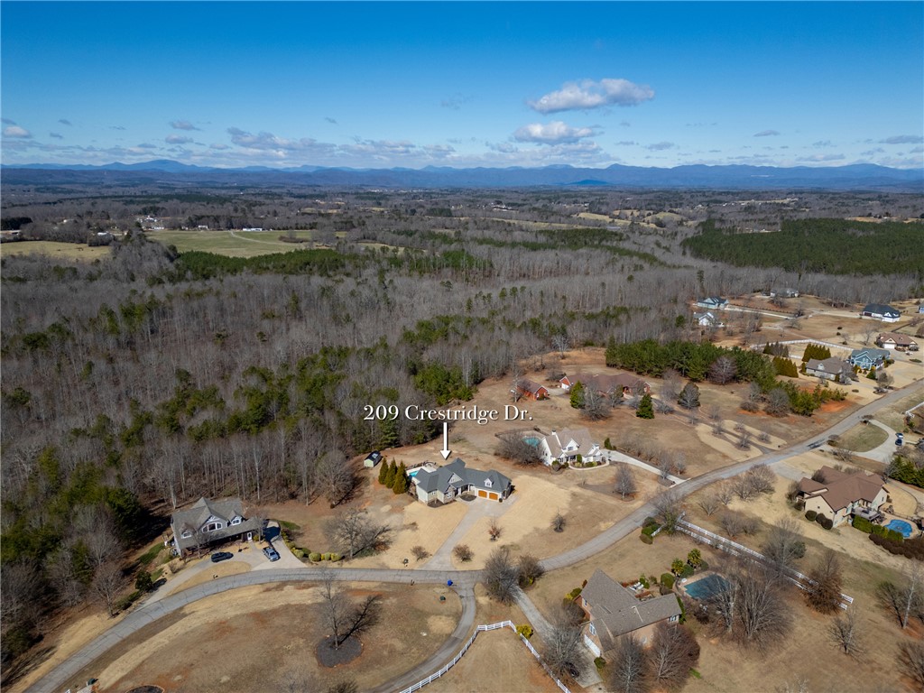 209 Crestridge Drive Seneca, SC 29672 - Photo 48 of 49 Expansive aerial views reveal a vast residential community nestled among rolling hills and natural landscapes.