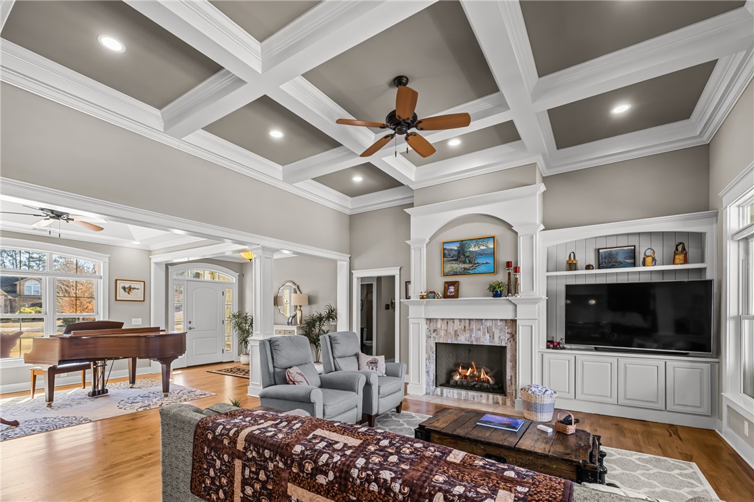 209 Crestridge Drive Seneca, SC 29672 - Photo 7 of 49 This grand living area features coffered ceilings, a fireplace, and gleaming hardwood floors.