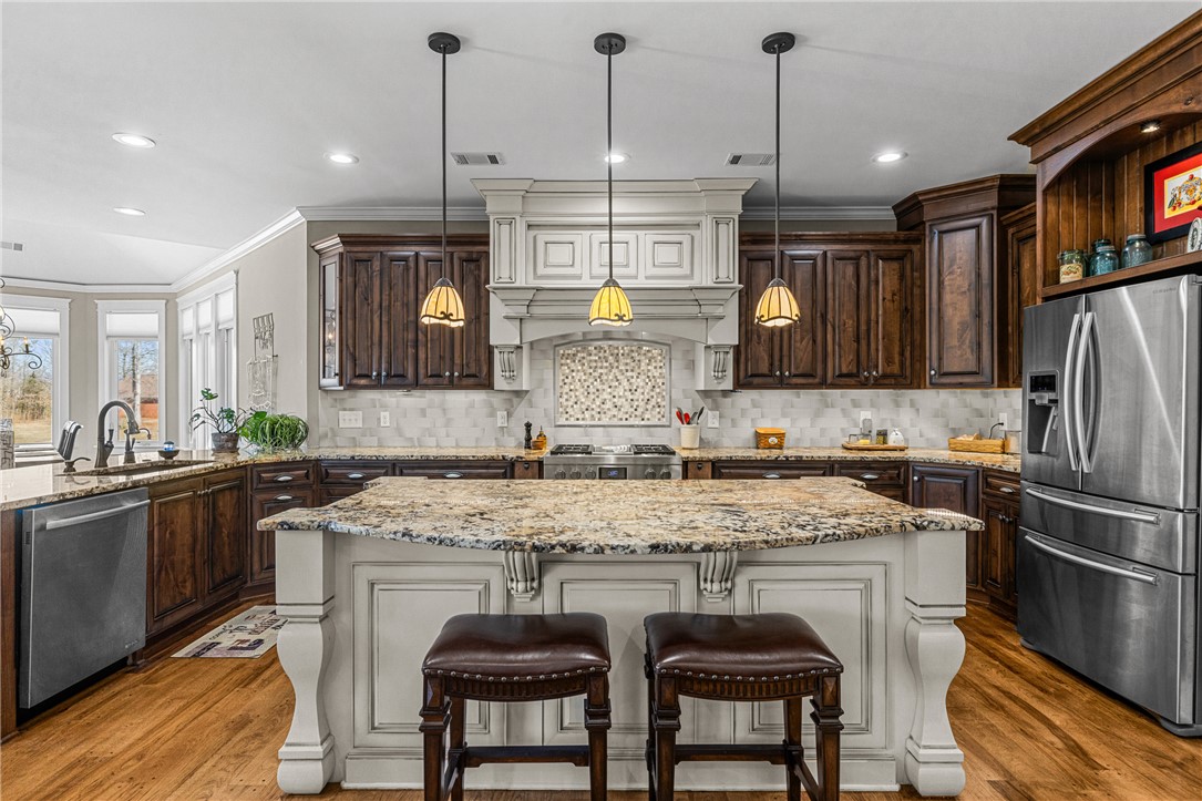 209 Crestridge Drive Seneca, SC 29672 - Photo 9 of 49 This spacious kitchen boasts ample counter space and rich wooden cabinetry, ideal for culinary adventures.