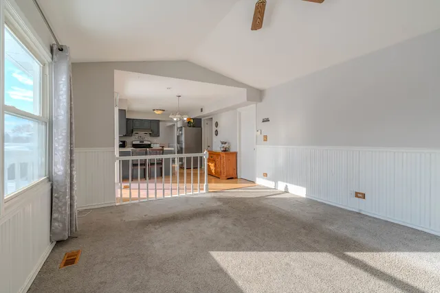 a view of a livingroom with a staircase