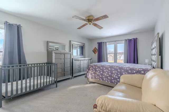 a bedroom with furniture and window