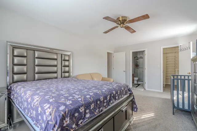 a bedroom with a bed and a closet