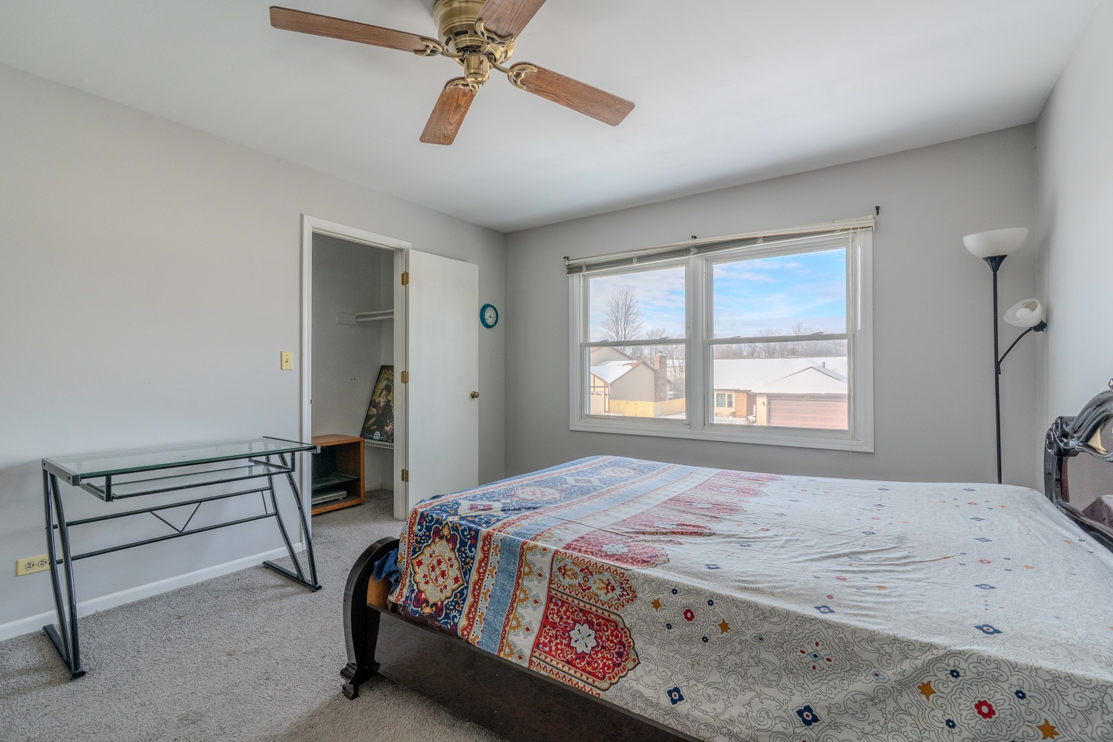 601 Bluff Street Carol Stream, IL 60188 - Photo 24 of 25 a bedroom with a bed and a chandelier