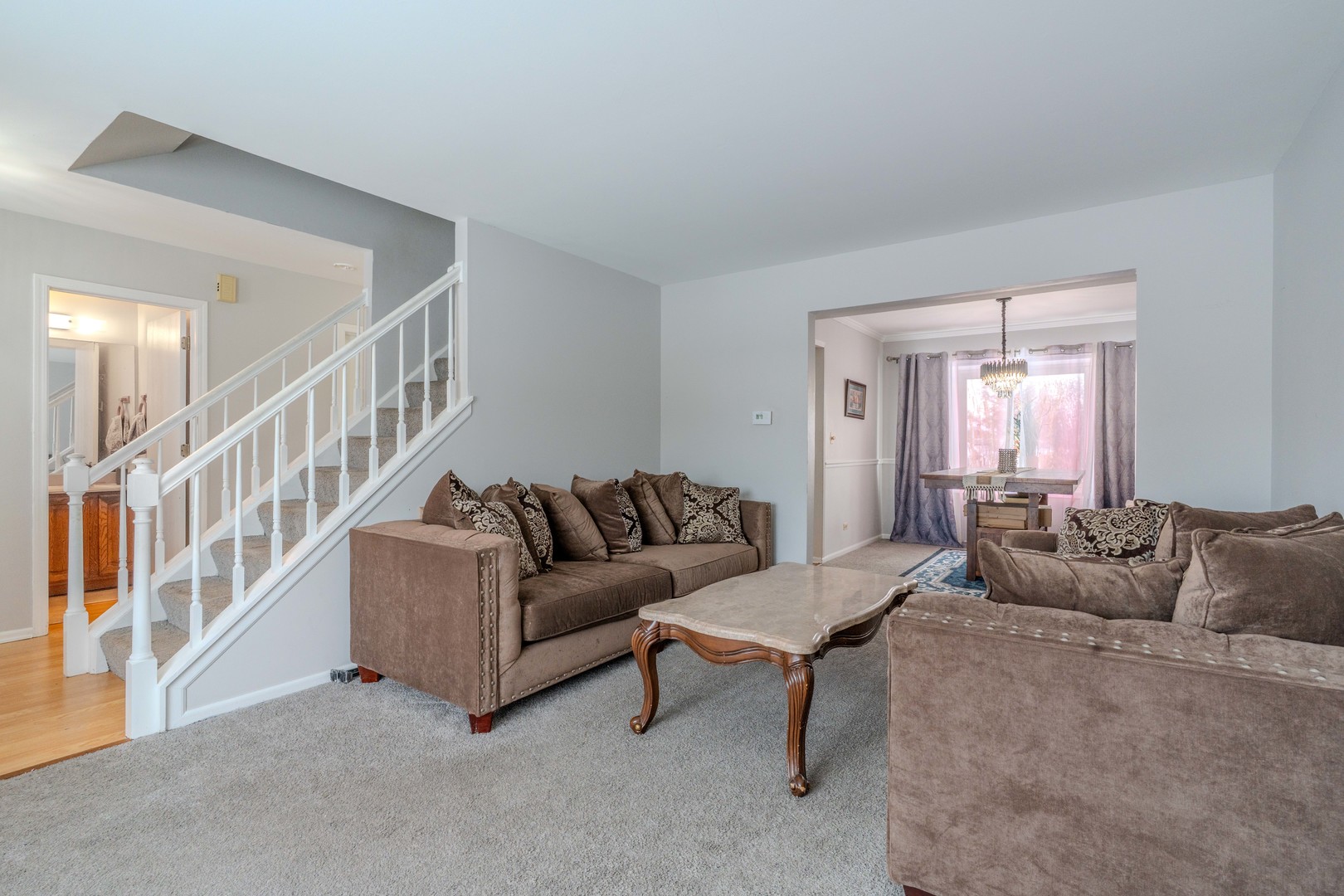 601 Bluff Street Carol Stream, IL 60188 - Photo 3 of 25 a living room with furniture and a couch