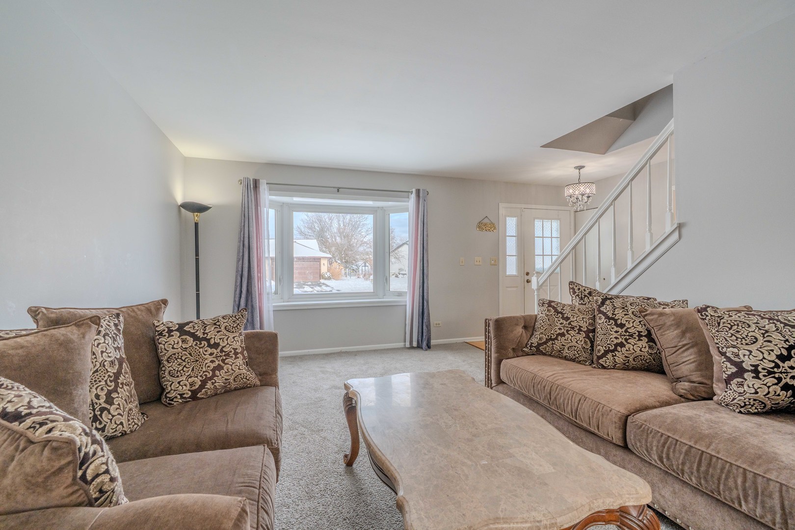 601 Bluff Street Carol Stream, IL 60188 - Photo 4 of 25 a living room with furniture and a couch