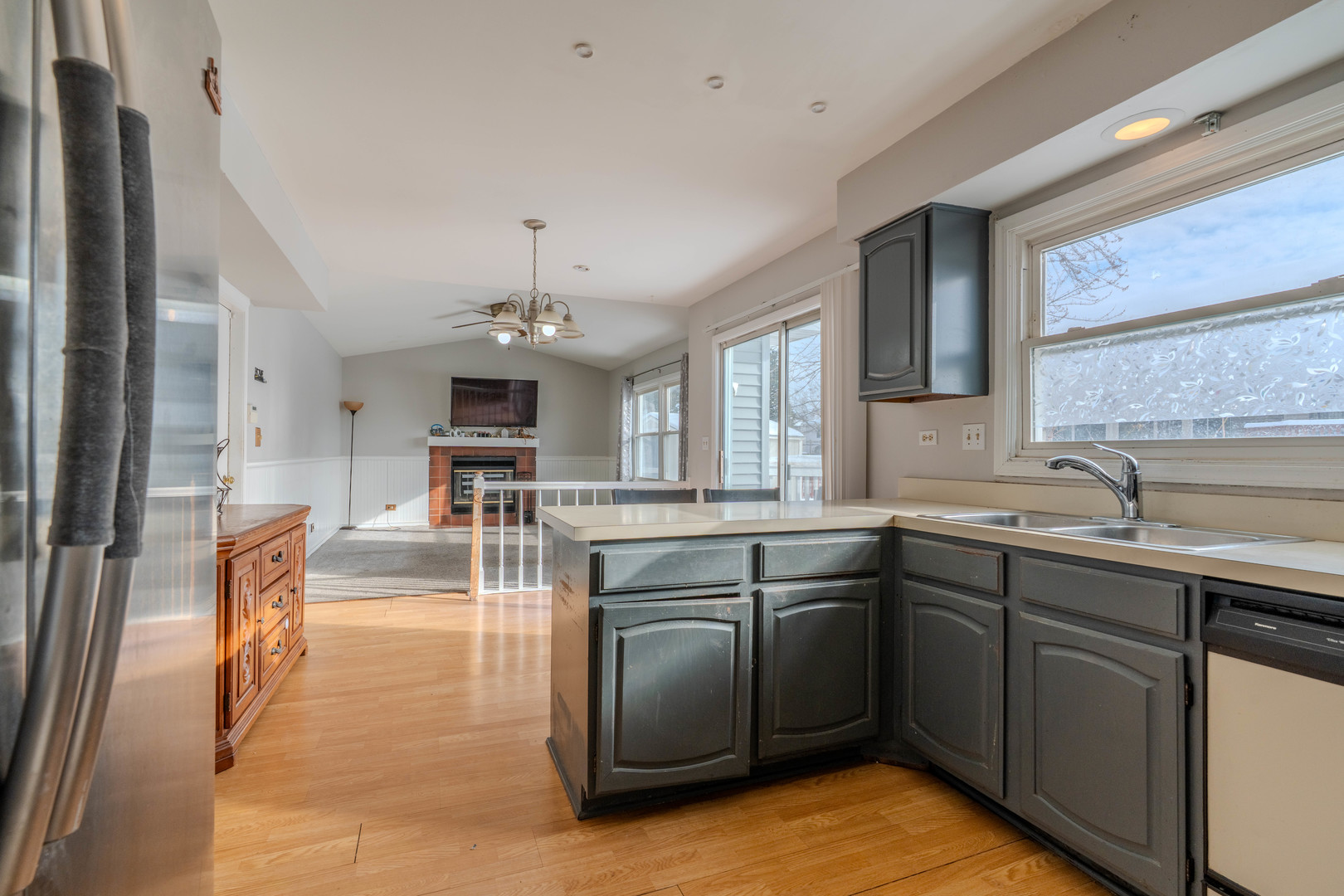 601 Bluff Street Carol Stream, IL 60188 - Photo 6 of 25 a kitchen with cabinets a sink dishwasher a stove and a refrigerator with wooden floor