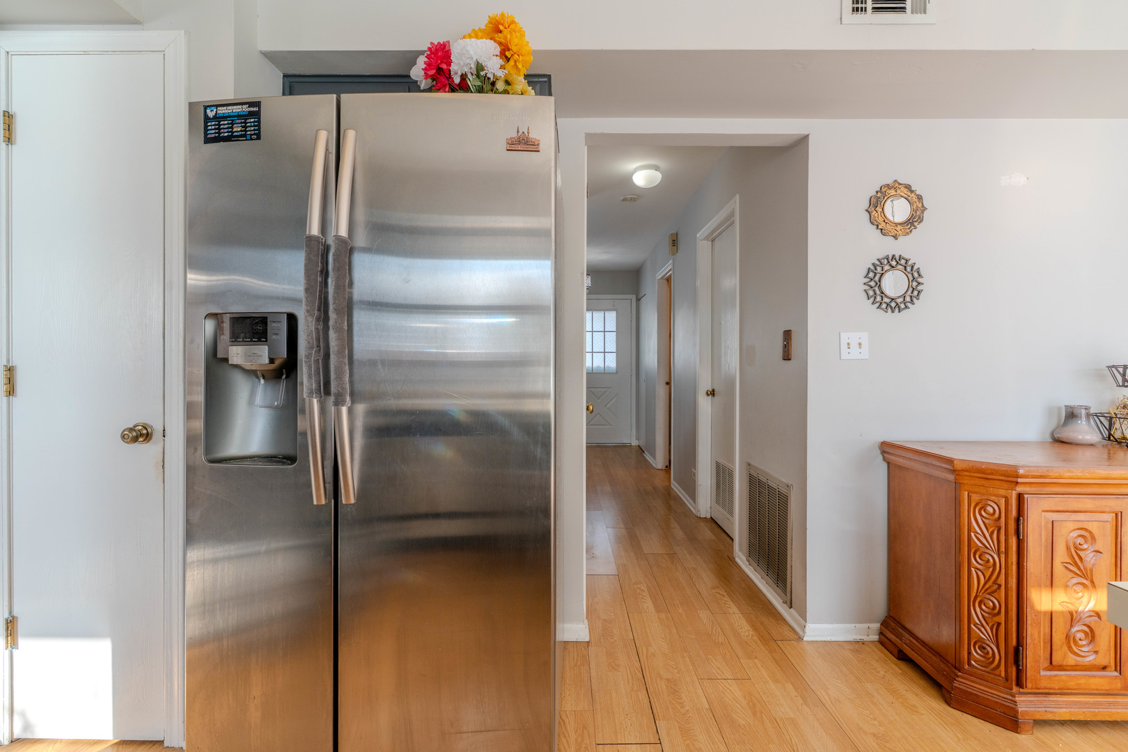 601 Bluff Street Carol Stream, IL 60188 - Photo 9 of 25 a kitchen with a refrigerator and wooden floor