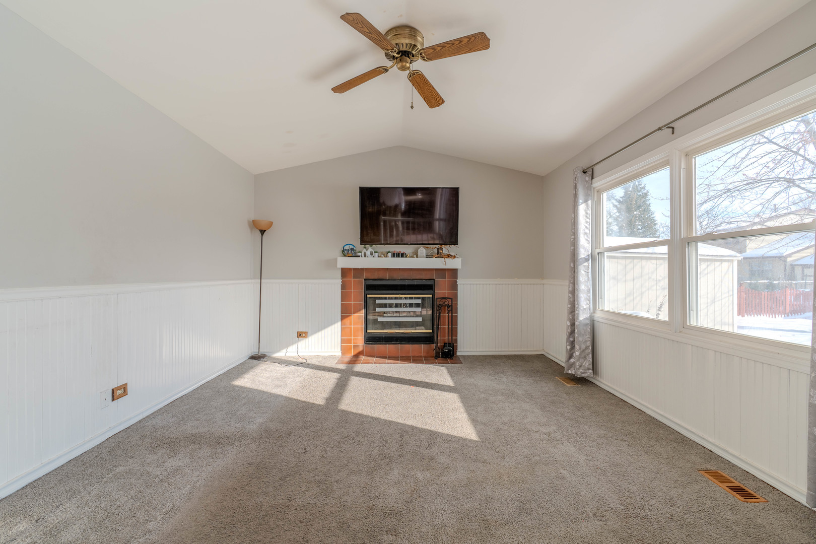 601 Bluff Street Carol Stream, IL 60188 - Photo 10 of 25 a living room with furniture and a flat screen tv