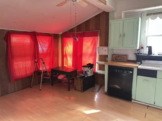 a kitchen with a refrigerator and a sink