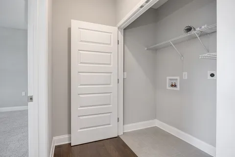 a view of an empty room with a closet