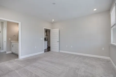 a bathroom with a shower curtain and a toilet