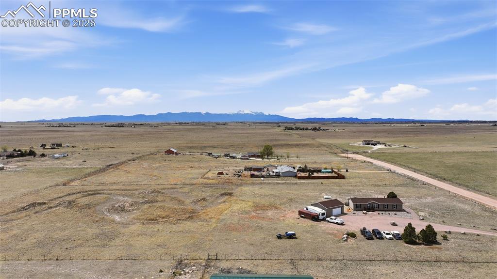 20985 McDaniels Road Calhan, CO 80808 - Photo 12 of 41 a view of a lake with houses in the back