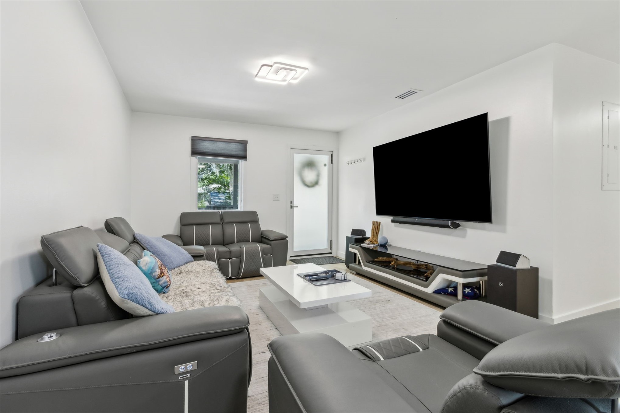 724 North 14th Street Fernandina Beach, FL 32034 - Photo 13 of 34 a living room with furniture and a flat screen tv