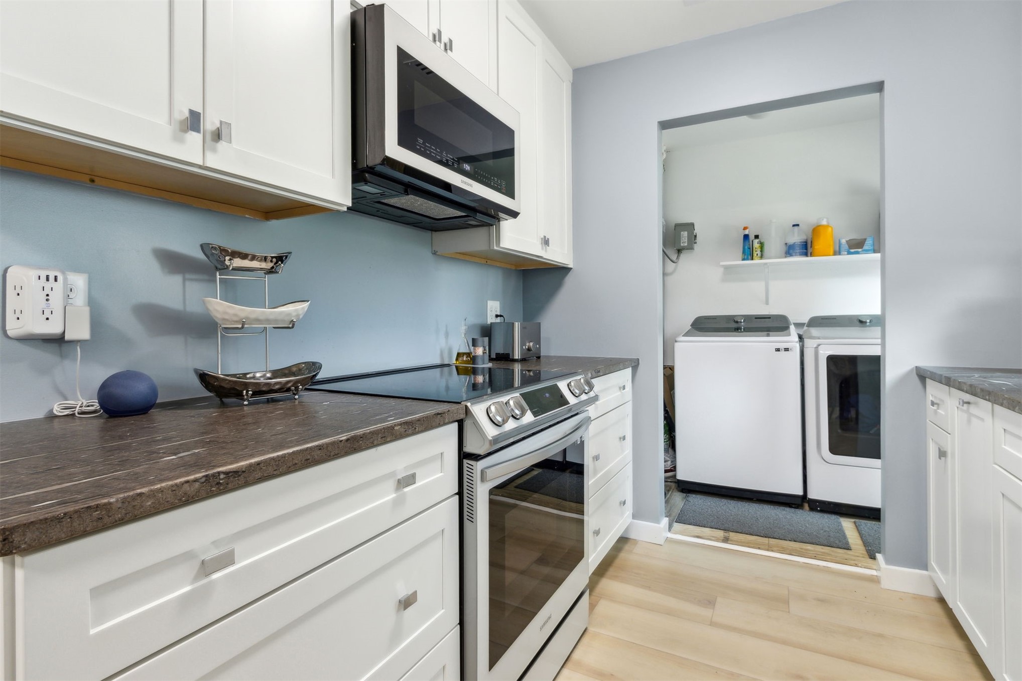 724 North 14th Street Fernandina Beach, FL 32034 - Photo 15 of 34 a kitchen with stainless steel appliances granite countertop a sink a stove and microwave