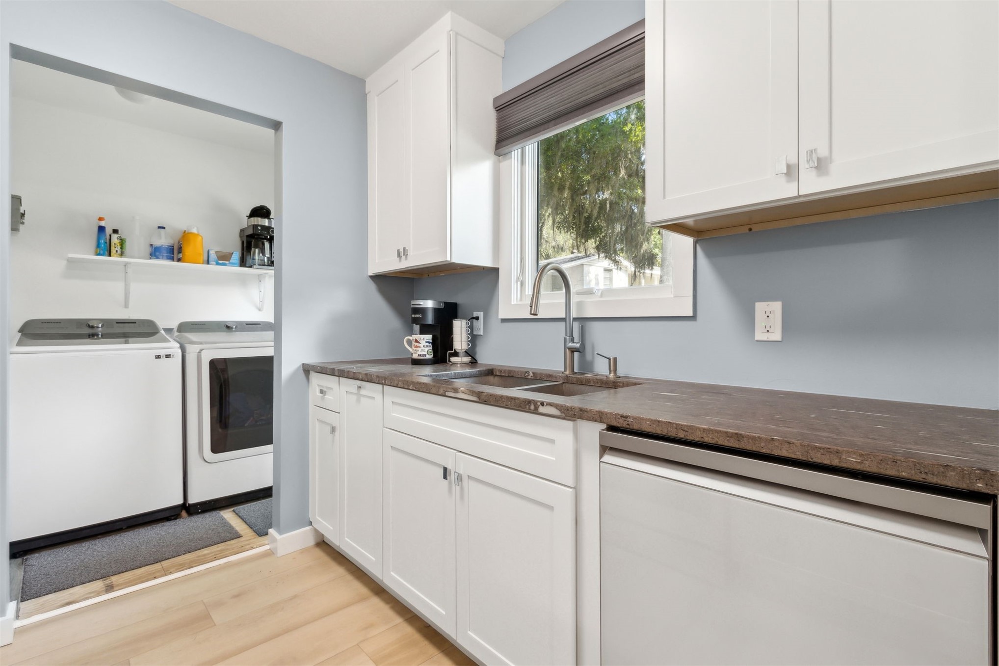 724 North 14th Street Fernandina Beach, FL 32034 - Photo 16 of 34 a kitchen with appliances cabinets and a sink