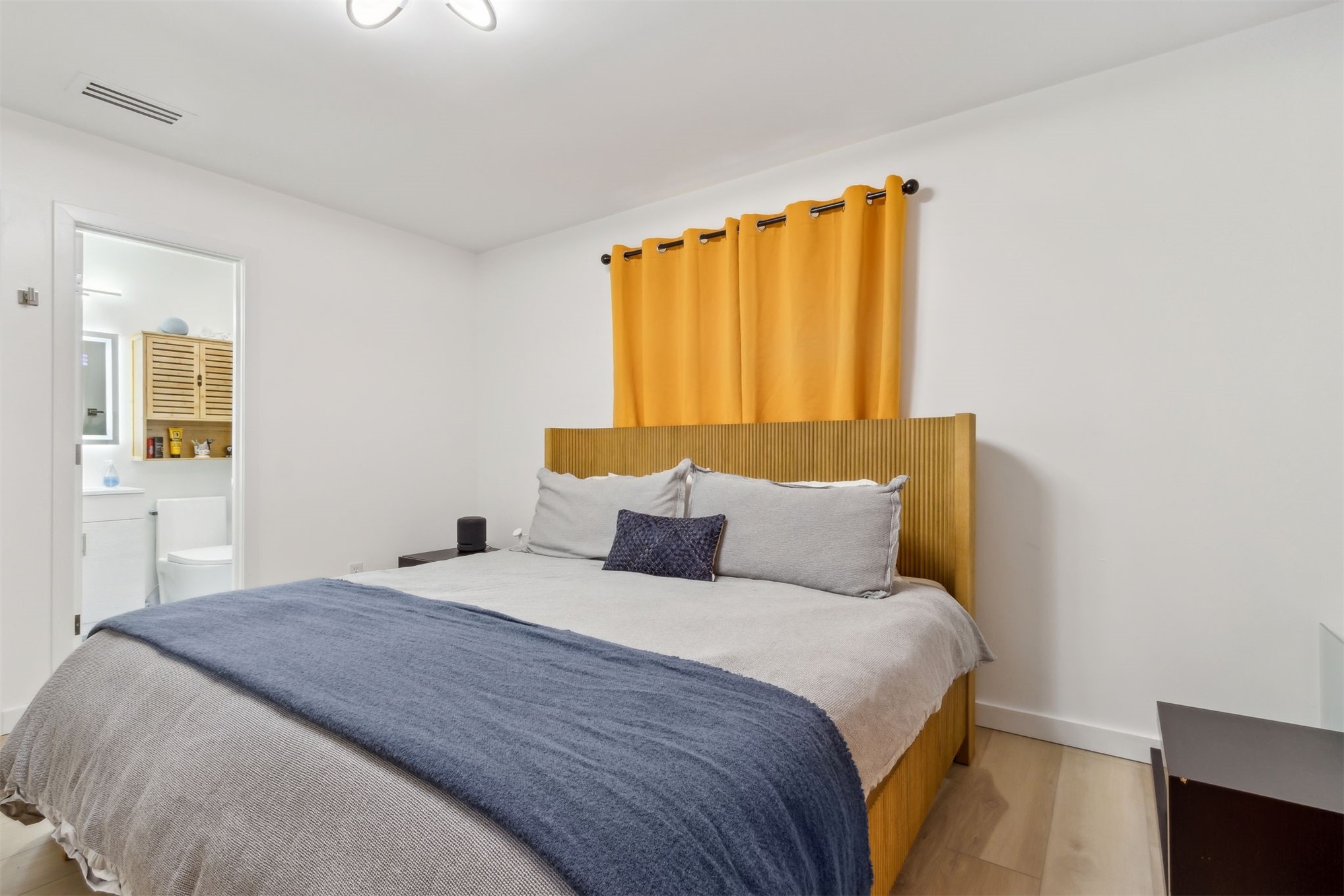 724 North 14th Street Fernandina Beach, FL 32034 - Photo 18 of 34 a bedroom with a bed and a window