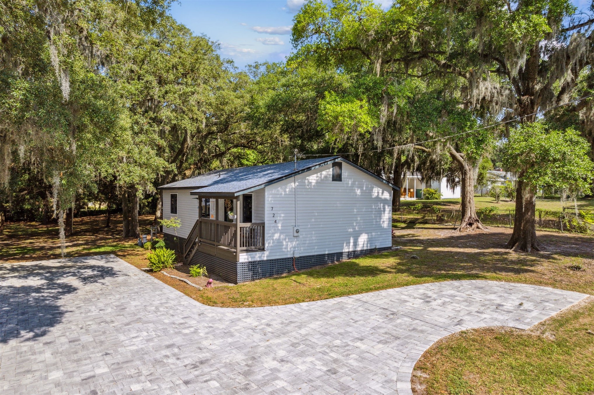 724 North 14th Street Fernandina Beach, FL 32034 - Photo 2 of 34 a view of a house with pool and a yard