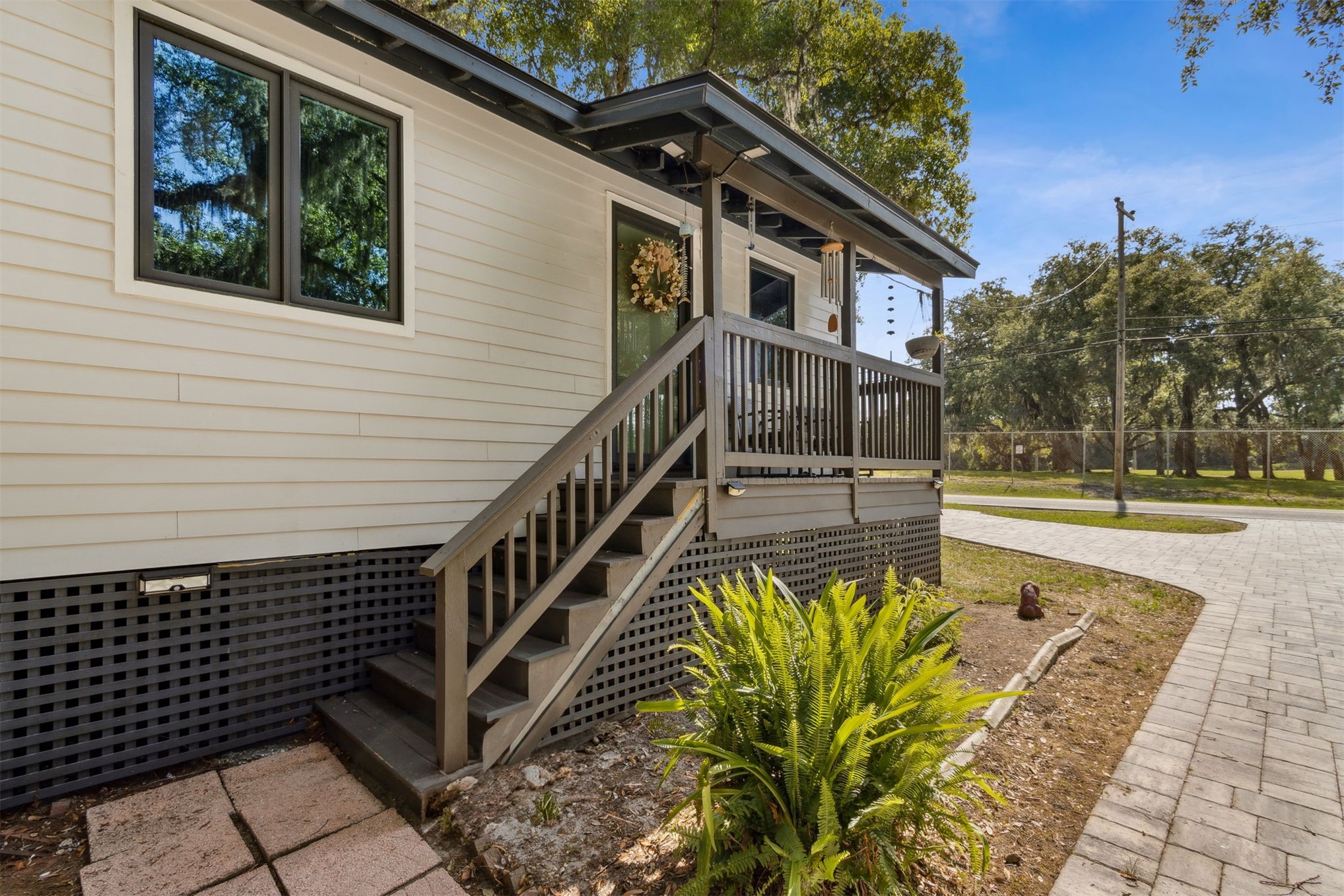 724 North 14th Street Fernandina Beach, FL 32034 - Photo 10 of 34 a view of a house with many windows next to a patio