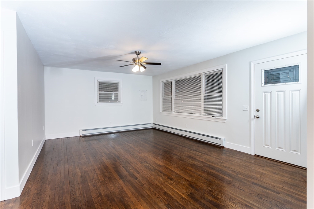 1560 West Main Road Middletown, RI 02842 - Photo 14 of 18 an empty room with wooden floor and window