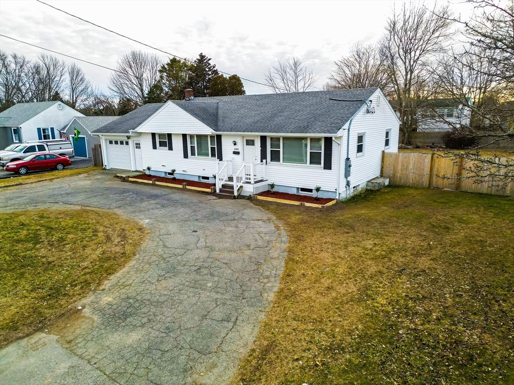 1560 West Main Road Middletown, RI 02842 - Photo 16 of 18 a front view of a house with a yard