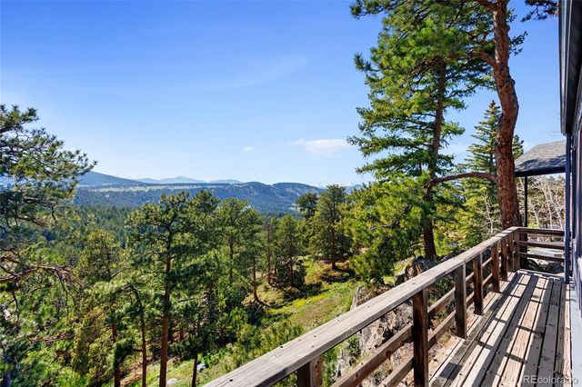 a view of a house with a mountain in the background