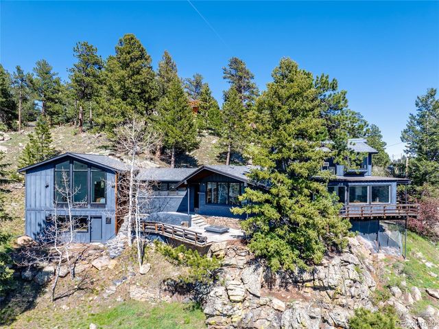 front view of a house with a tree