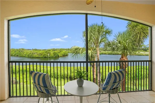 a view of a balcony with furniture