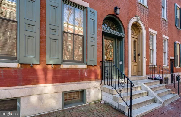 a view of front door with staircase