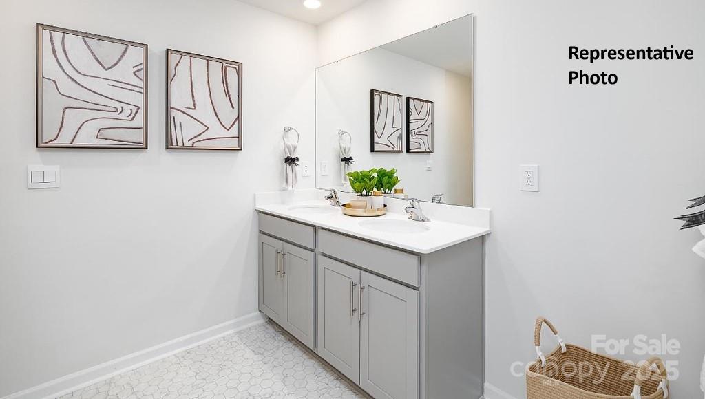 545 Trading Post Lane York, SC 29745 - Photo 12 of 25 a bathroom with a sink a vanity and a painting