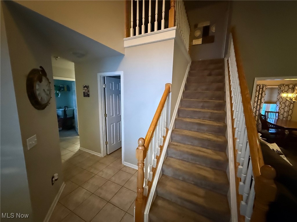 1201 Mulberry Run Mineral Ridge, OH 44440 - Photo 2 of 21 Staircase with tile patterned flooring