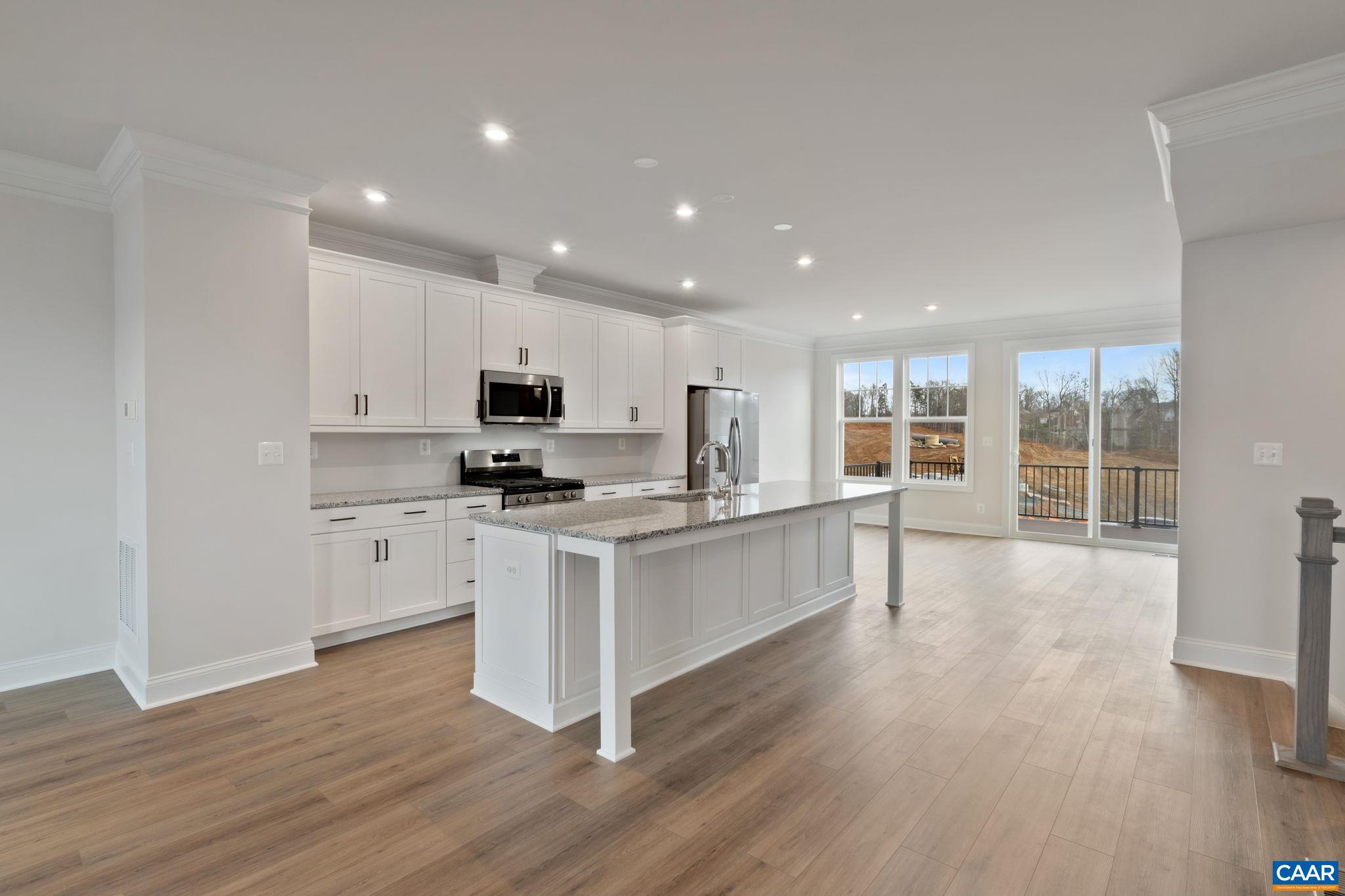 23 Talen Lane Charlottesville, VA 22911 - Photo 8 of 44 a kitchen with stainless steel appliances granite countertop a stove top oven a sink a refrigerator and white cabinets with wooden floor