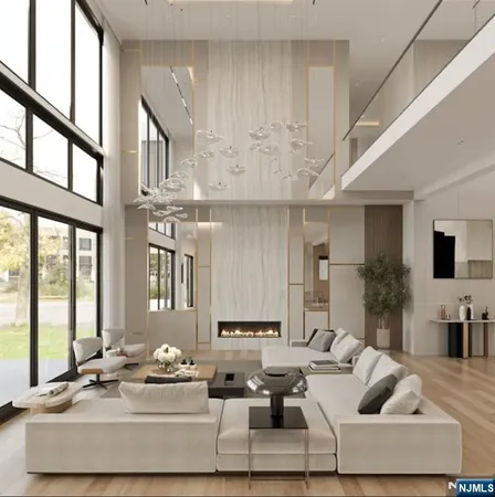 a living room with furniture and large windows
