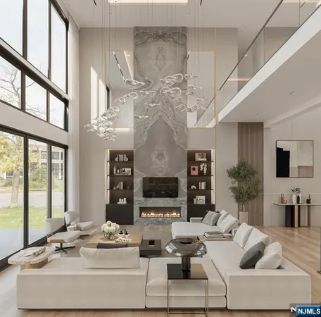 a living room with fireplace furniture a flat screen tv and a large window