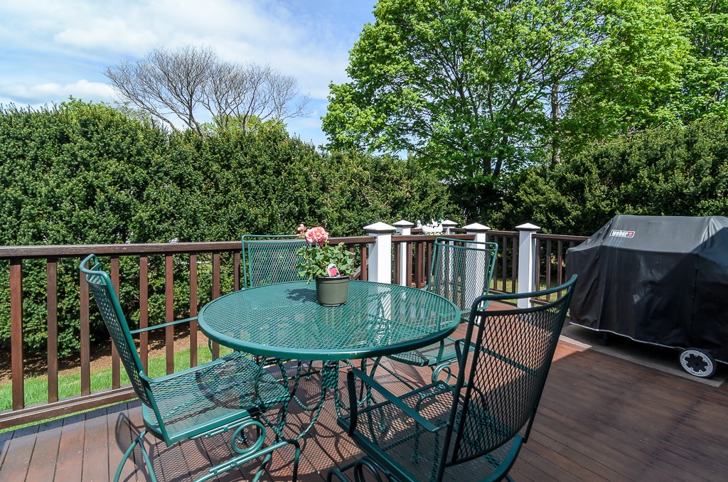 15 Virginia Road Arlington, MA 02476 - Photo 20 of 21 a balcony with table and chairs