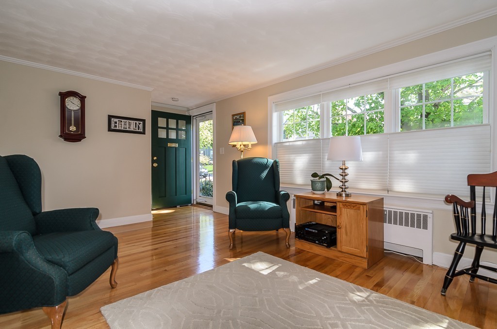 15 Virginia Road Arlington, MA 02476 - Photo 4 of 21 a living room with furniture and a fireplace