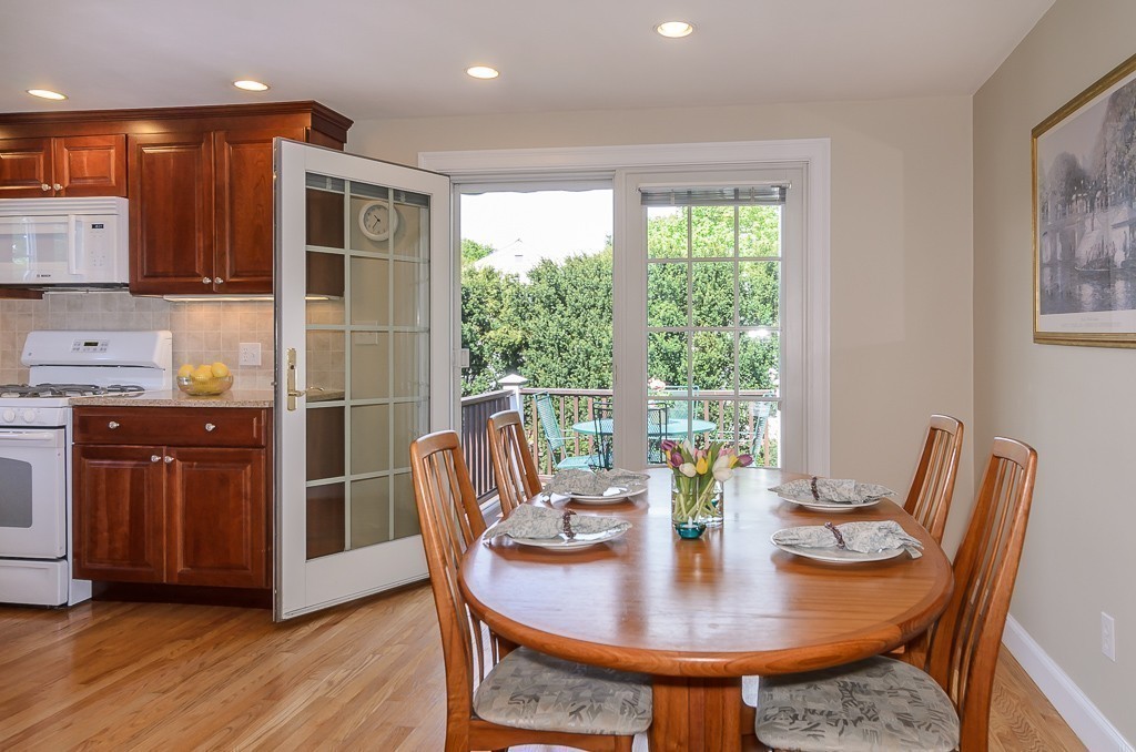 15 Virginia Road Arlington, MA 02476 - Photo 10 of 21 a view of a dining room with furniture and wooden floor