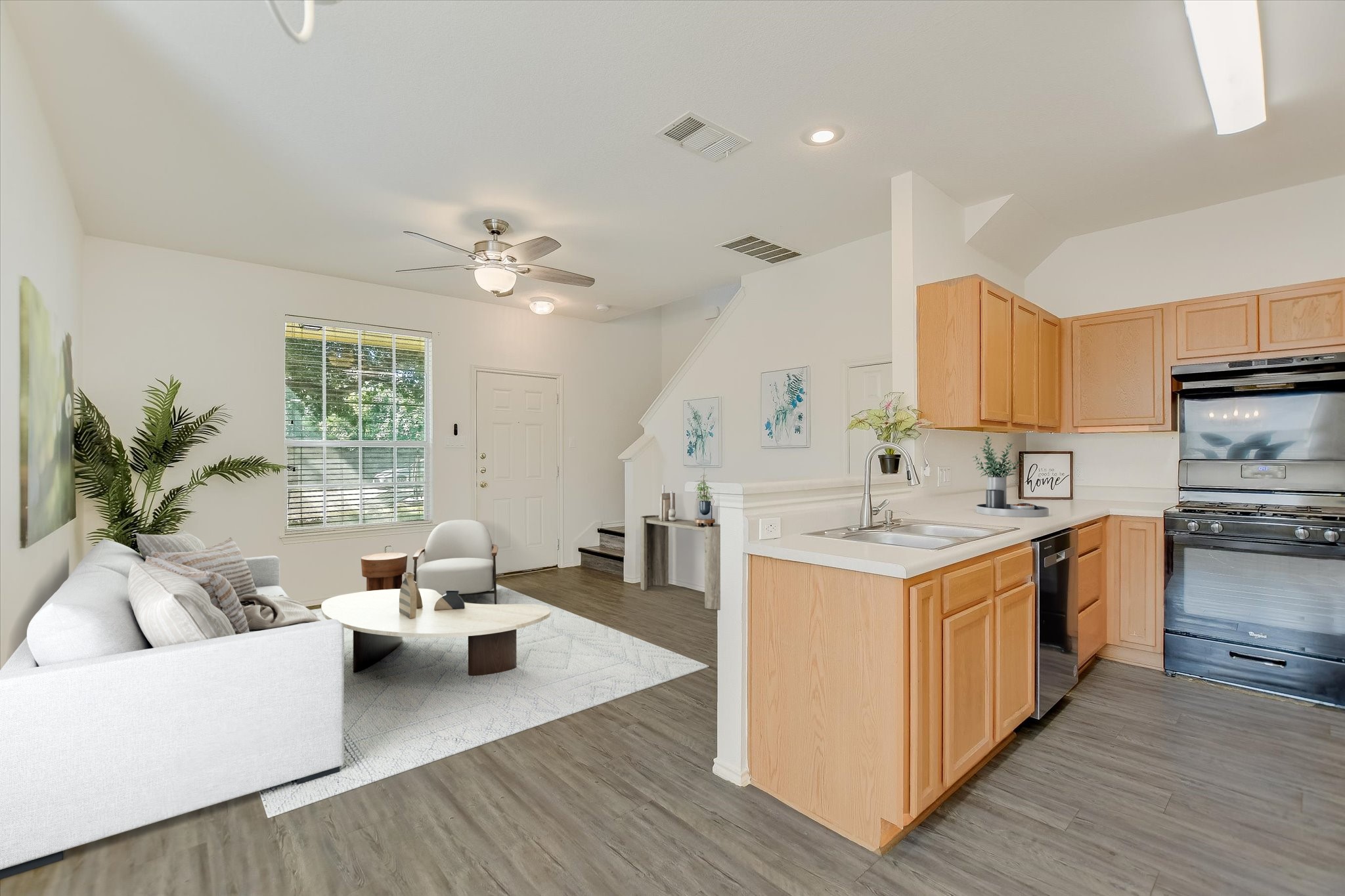 809 Sebastian Bend, Unit B Pflugerville, TX 78660 - Photo 33 of 34 Kitchen with light wood finish cabinetry, open floor plan, light
countertops, black gas range, and light wood-type flooring
*Virtually Staged*