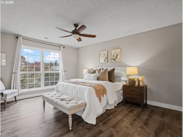 a bed room with a bed and a window