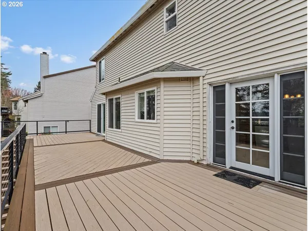 a view of a backyard with plants and a patio