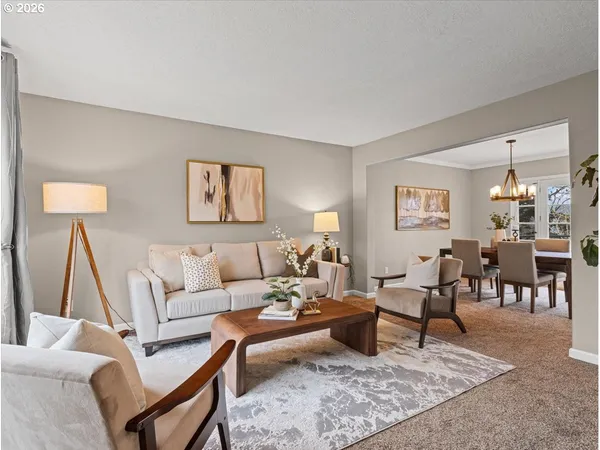 a living room with furniture and a rug