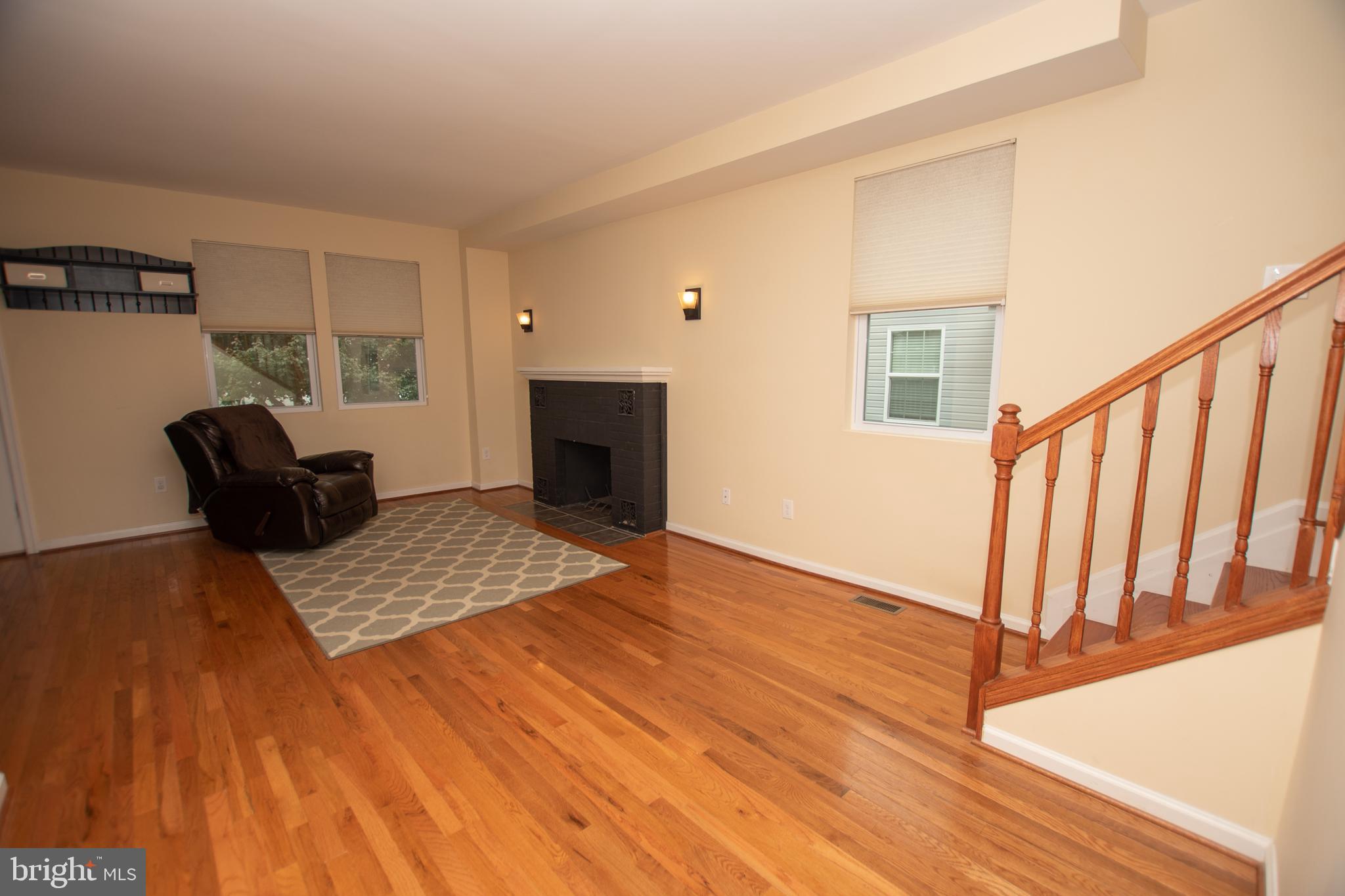 67 Edmondson Ridge Road Baltimore, MD 21228 - Photo 28 of 41 a view of an empty room with wooden floor and a window