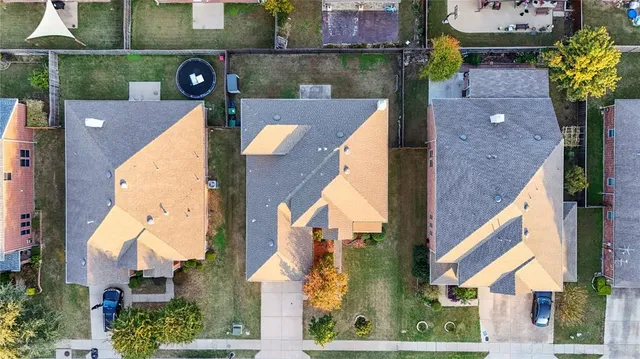 an aerial view of houses with yard