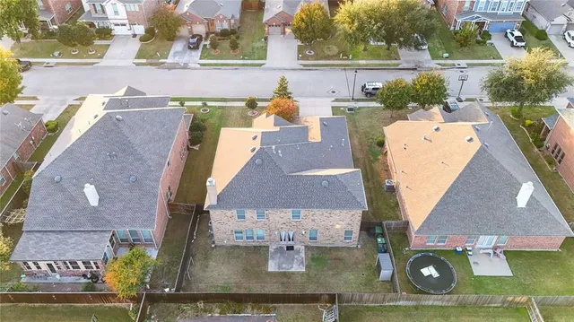 an aerial view of a house with outdoor space