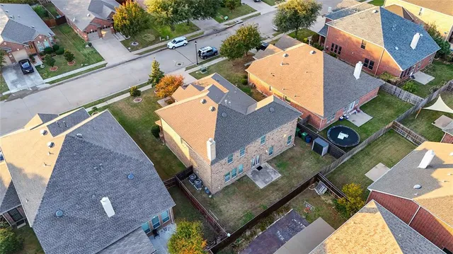 an aerial view of house with yard