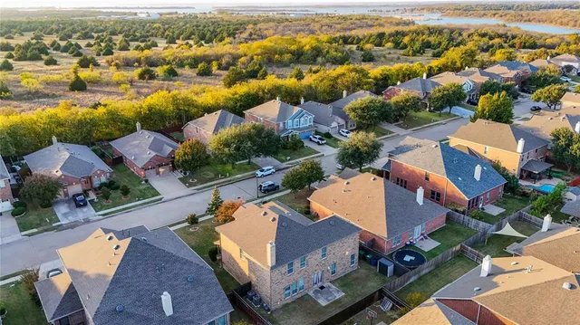 an aerial view of residential houses with outdoor space