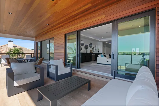 a lobby with furniture and a potted plant